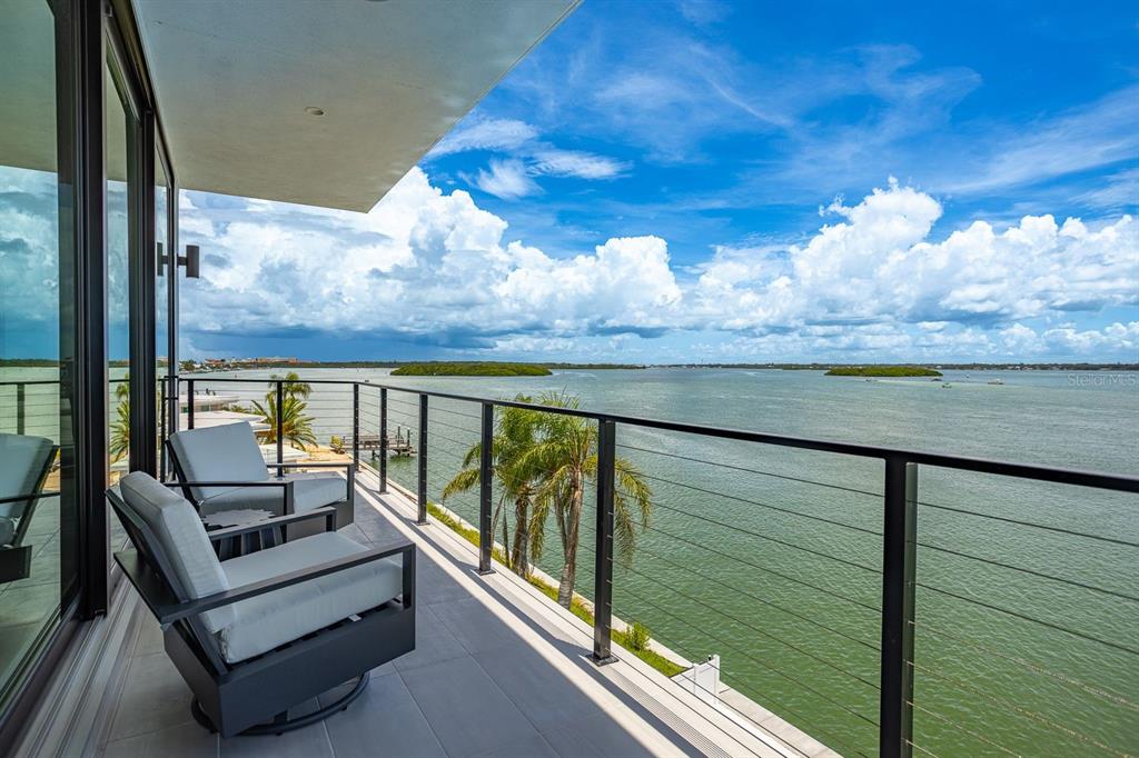445 129th Avenue East Madeira Beach, FL 33708 - Photo 39 of 72 a view of a balcony with furniture