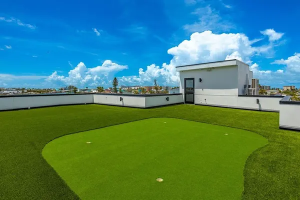 a view of a balcony with chairs
