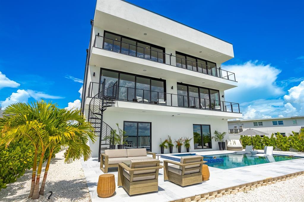 445 129th Avenue East Madeira Beach, FL 33708 - Photo 47 of 72 a view of a building with a patio