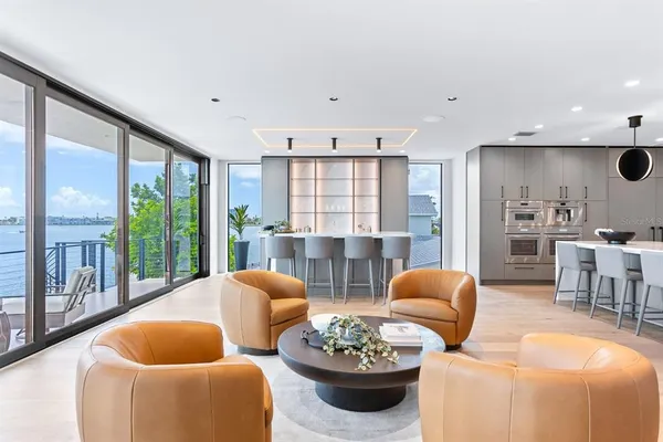 a large kitchen with a table and chairs