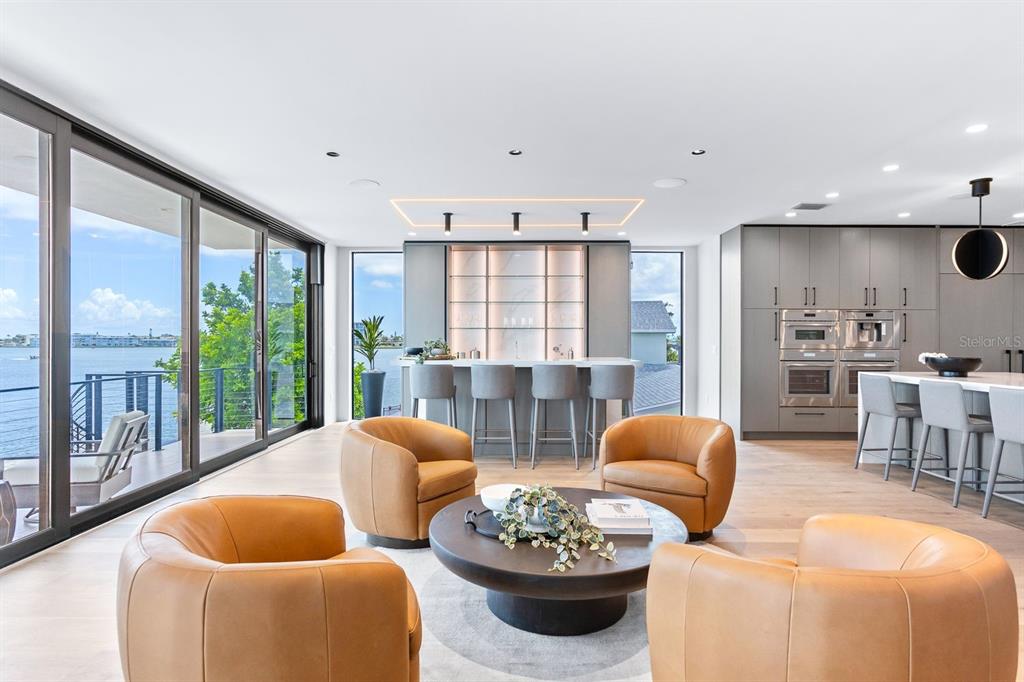 445 129th Avenue East Madeira Beach, FL 33708 - Photo 9 of 72 a living room with furniture and a large window