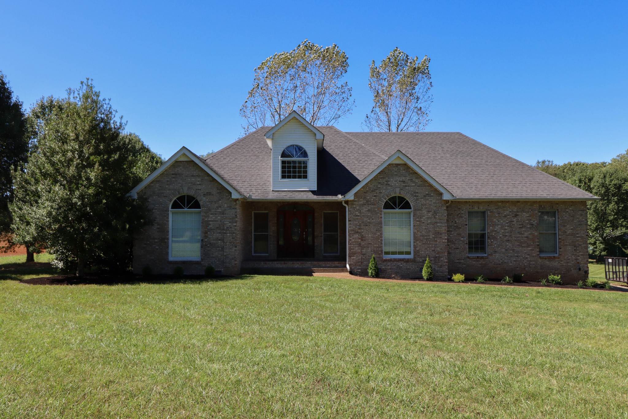4170 Fizer Road Springfield, TN 37172 - Photo 1 of 21 a front view of a house with a yard and garage