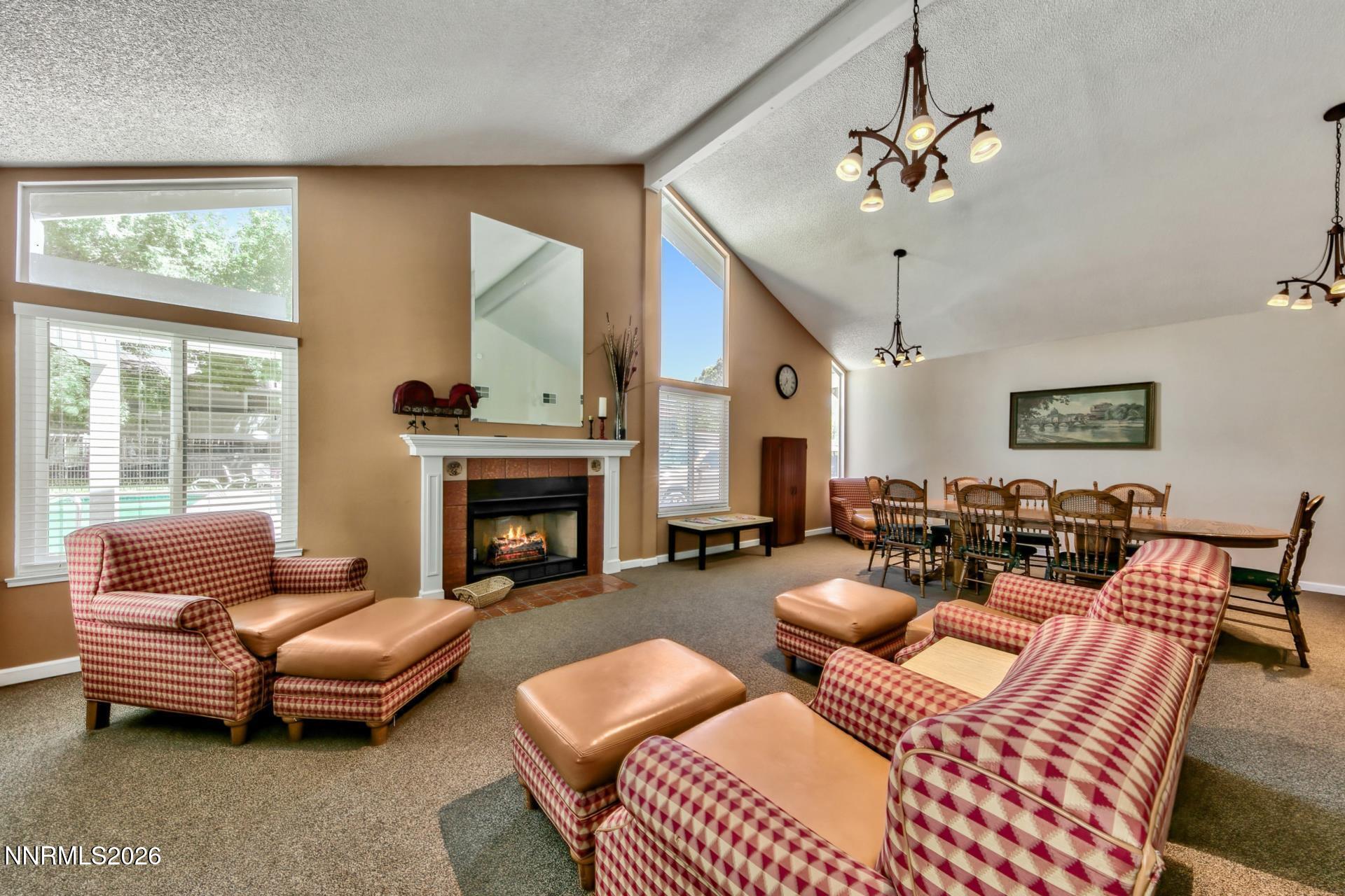 400 South Saliman Road, Unit 14 Carson City, NV 89701 - Photo 14 of 35 a living room with furniture a fireplace and a large mirror
