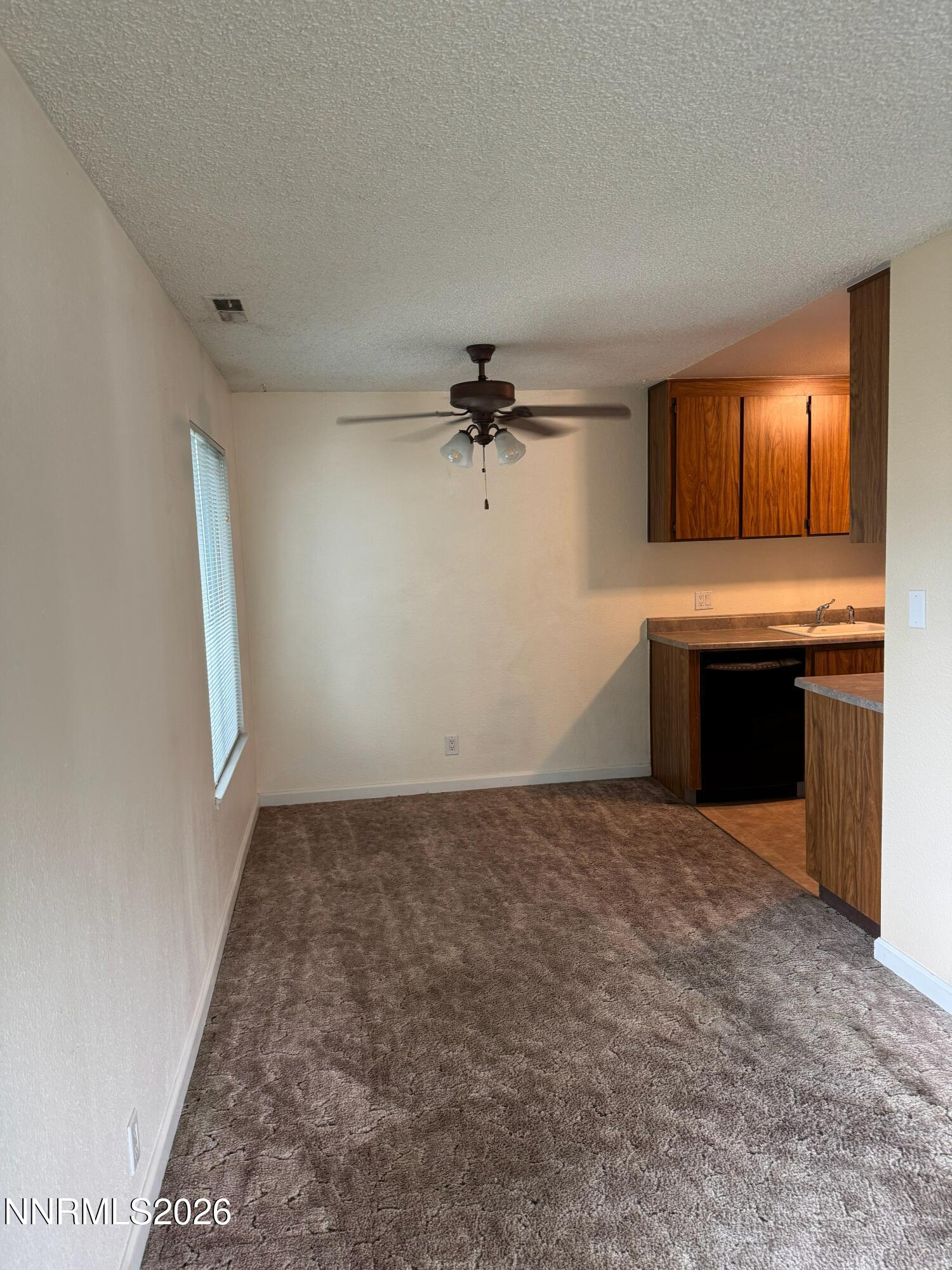 400 South Saliman Road, Unit 14 Carson City, NV 89701 - Photo 20 of 35 an empty room with a stove and a sink