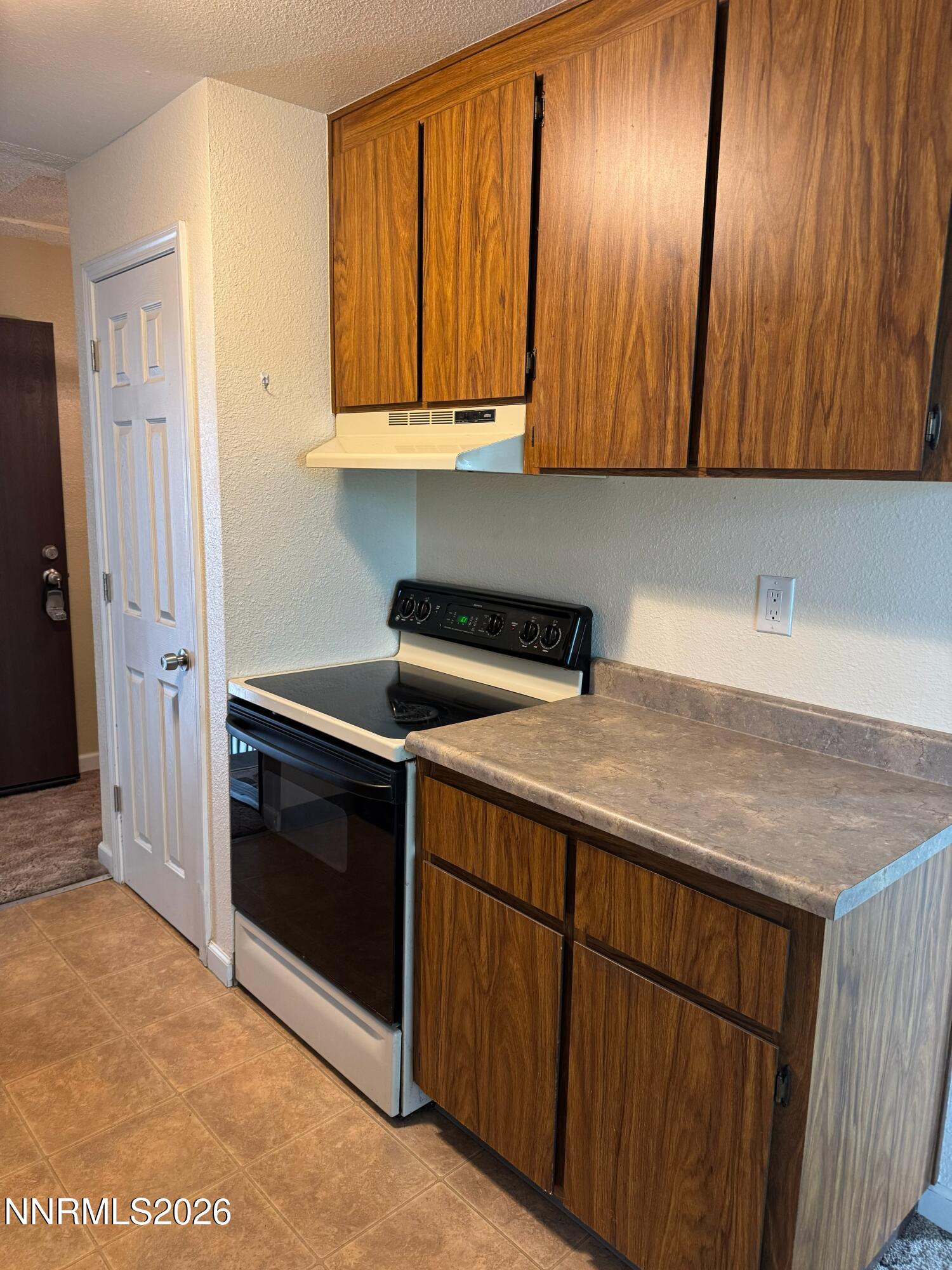 400 South Saliman Road, Unit 14 Carson City, NV 89701 - Photo 21 of 35 a kitchen with stainless steel appliances granite countertop wooden cabinets and a stove