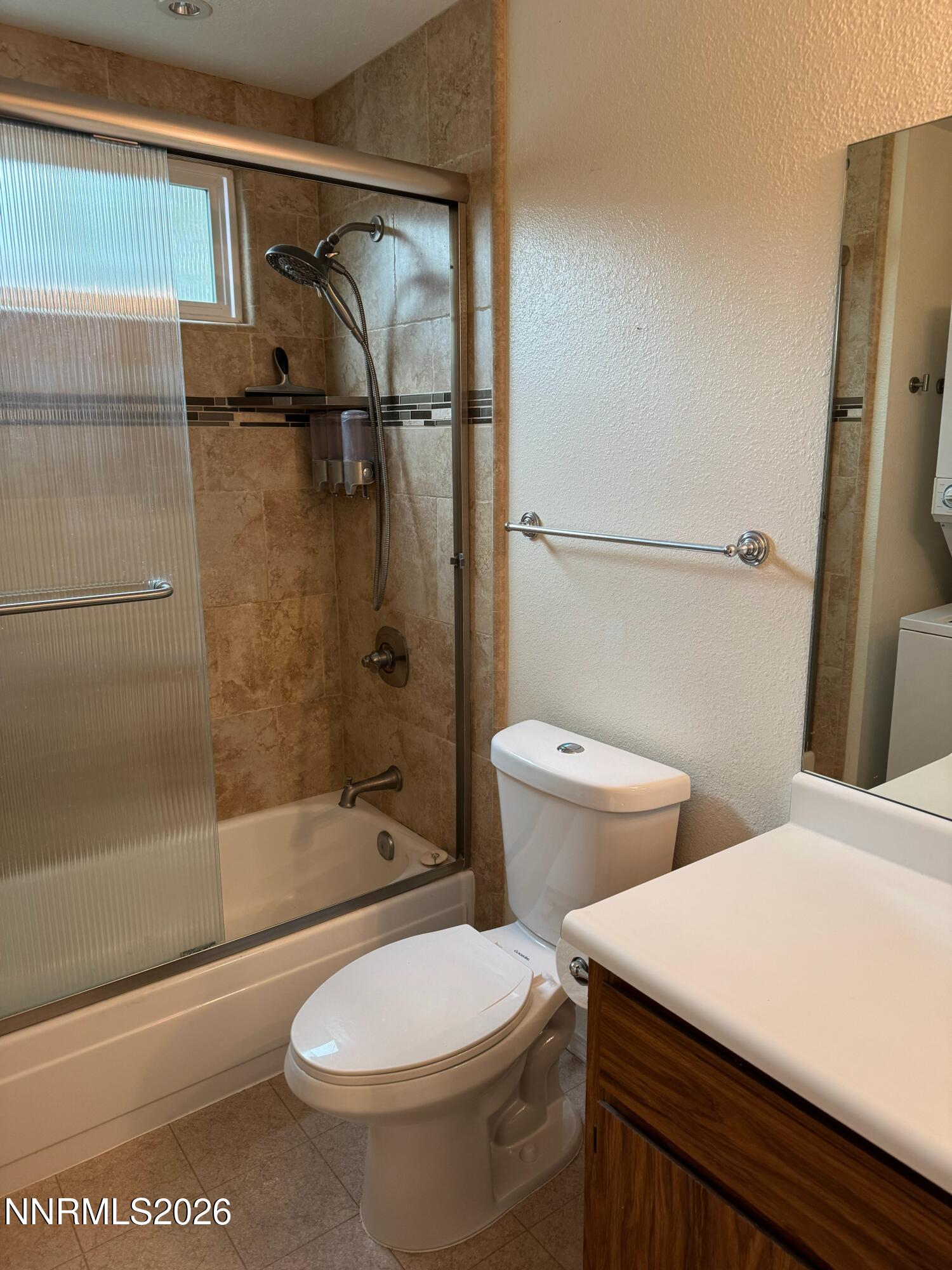 400 South Saliman Road, Unit 14 Carson City, NV 89701 - Photo 25 of 35 a white toilet sitting next to a bath tub and a shower
