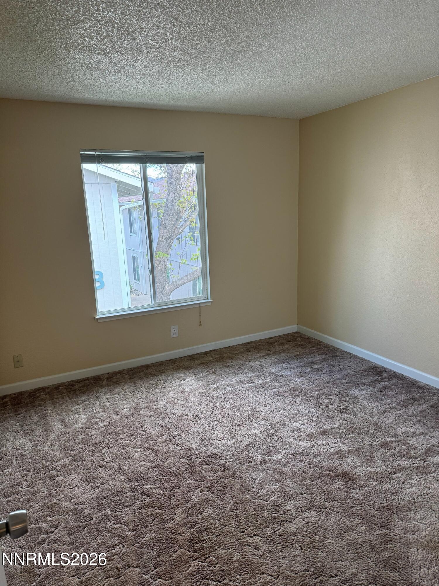 400 South Saliman Road, Unit 14 Carson City, NV 89701 - Photo 27 of 35 an empty room with windows