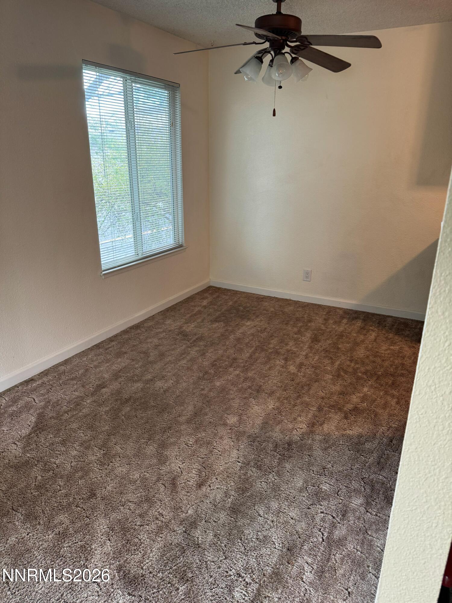 400 South Saliman Road, Unit 14 Carson City, NV 89701 - Photo 31 of 35 an empty room with a empty space and windows