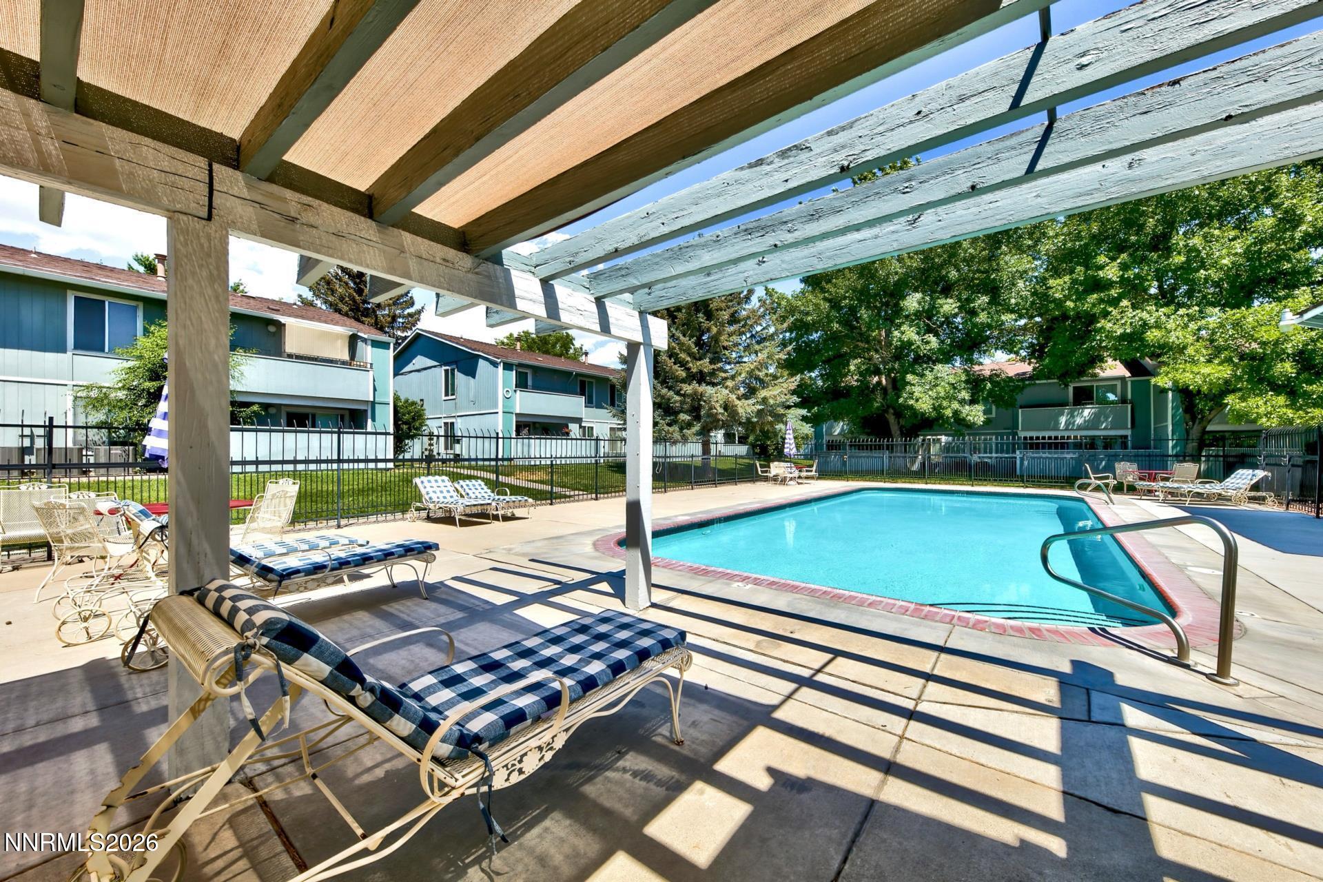 400 South Saliman Road, Unit 14 Carson City, NV 89701 - Photo 5 of 35 a view of a patio with a table and chairs