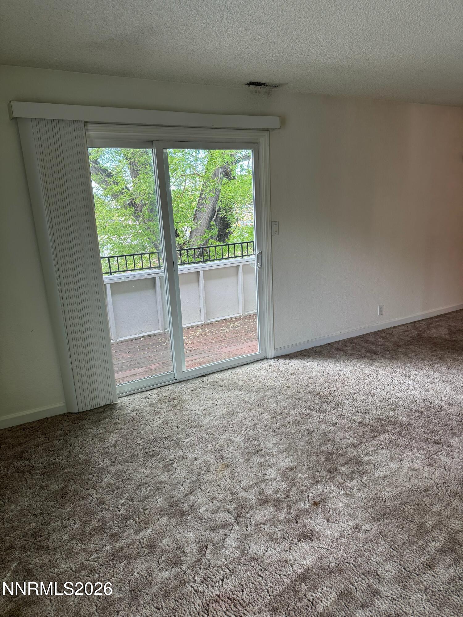 400 South Saliman Road, Unit 14 Carson City, NV 89701 - Photo 10 of 35 a view of an empty room with a window