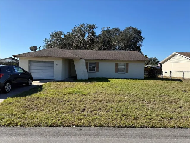 a house with trees in the background