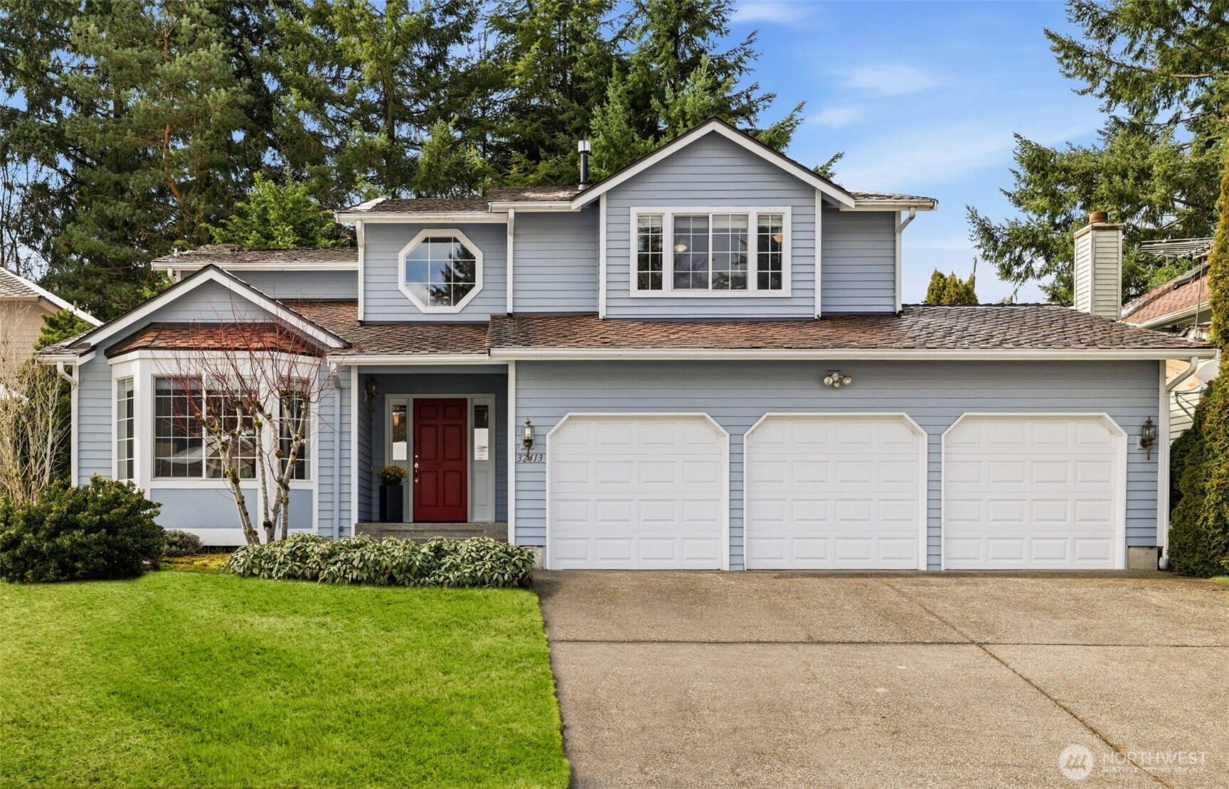 32413 7th Avenue Southwest Federal Way, WA 98023 - Photo 1 of 39 a front view of a house with a yard and garage