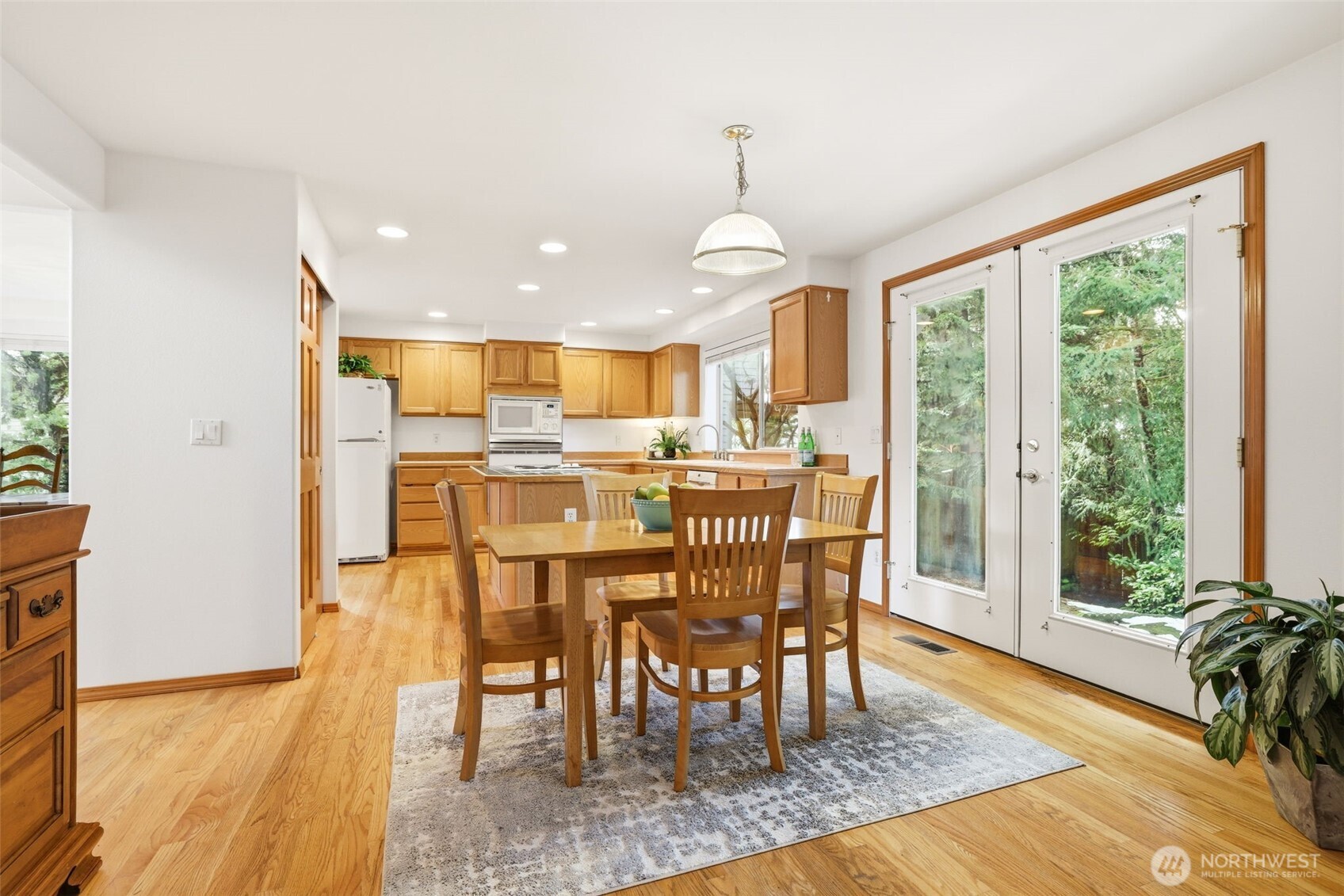32413 7th Avenue Southwest Federal Way, WA 98023 - Photo 15 of 39 a view of a dining room with furniture window and wooden floor