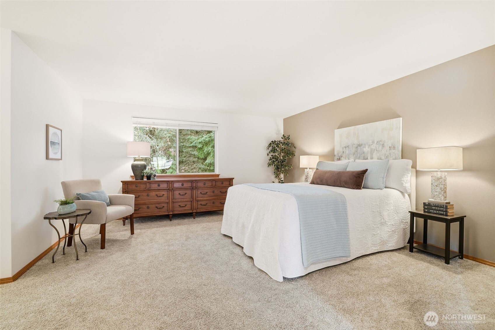 32413 7th Avenue Southwest Federal Way, WA 98023 - Photo 19 of 39 a spacious bedroom with a bed a table and chair