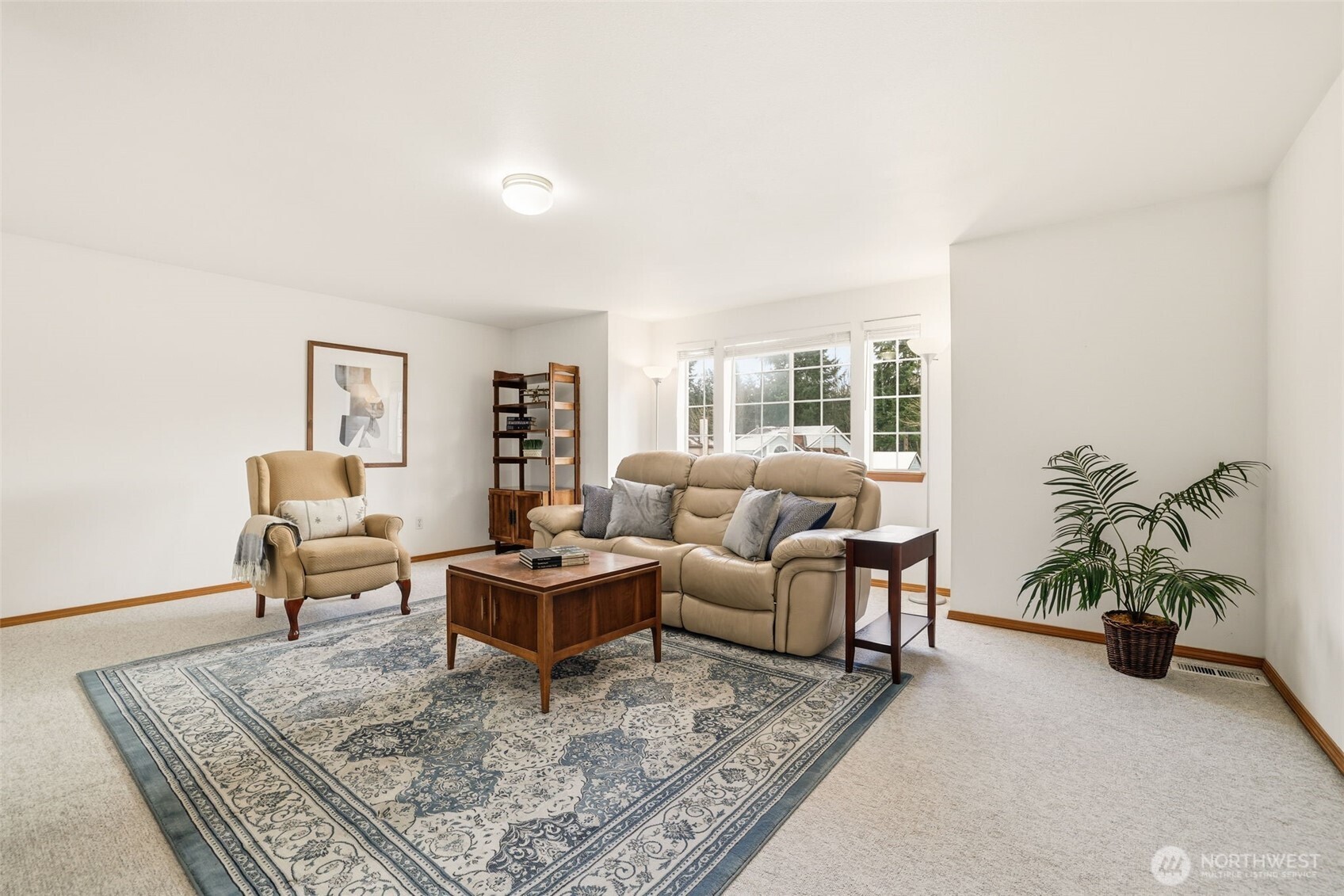 32413 7th Avenue Southwest Federal Way, WA 98023 - Photo 27 of 39 a living room with furniture and a potted plant