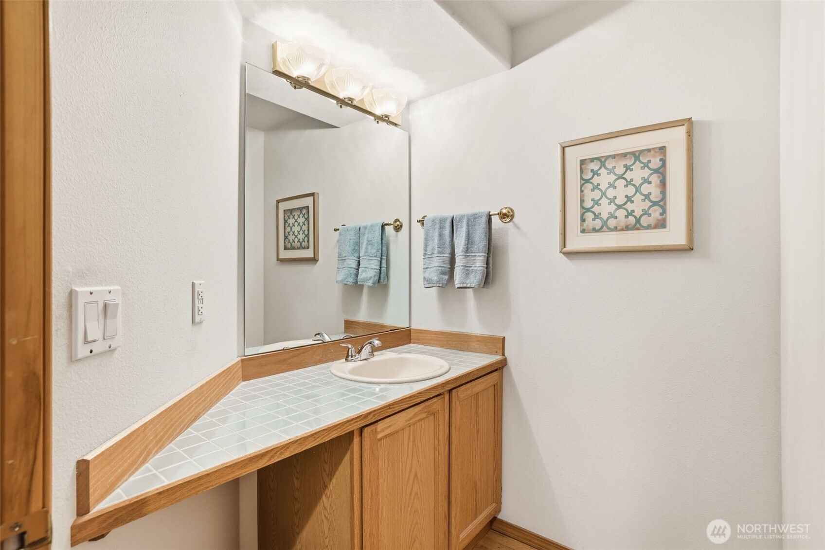32413 7th Avenue Southwest Federal Way, WA 98023 - Photo 31 of 39 a bathroom with a sink and a mirror