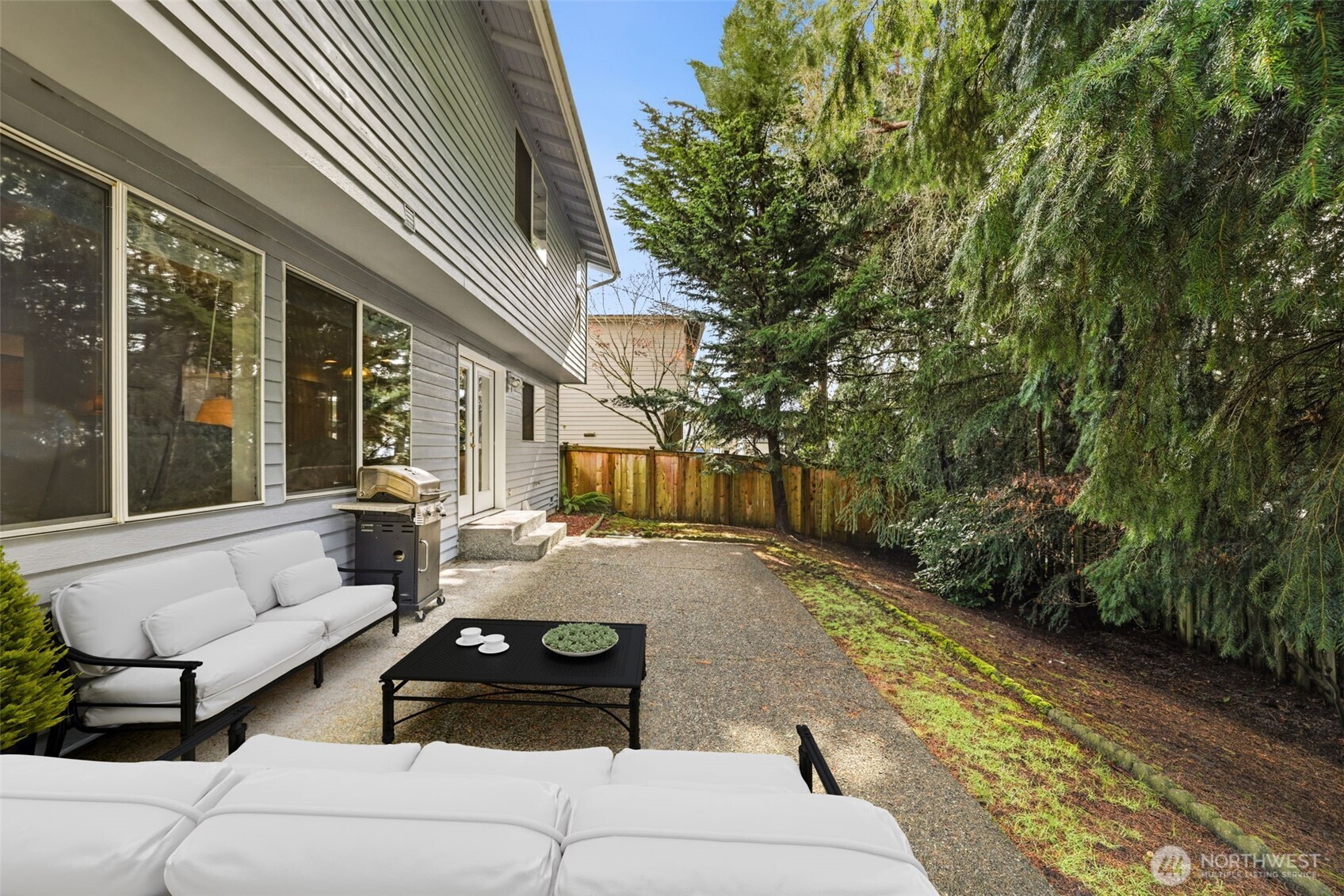 32413 7th Avenue Southwest Federal Way, WA 98023 - Photo 35 of 39 a view of a patio with couches and a potted plant on a table