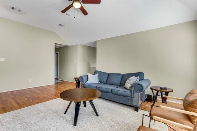 a living room with furniture and a rug