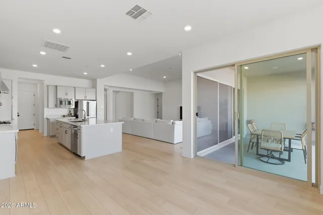 a bedroom with a bed and cabinets