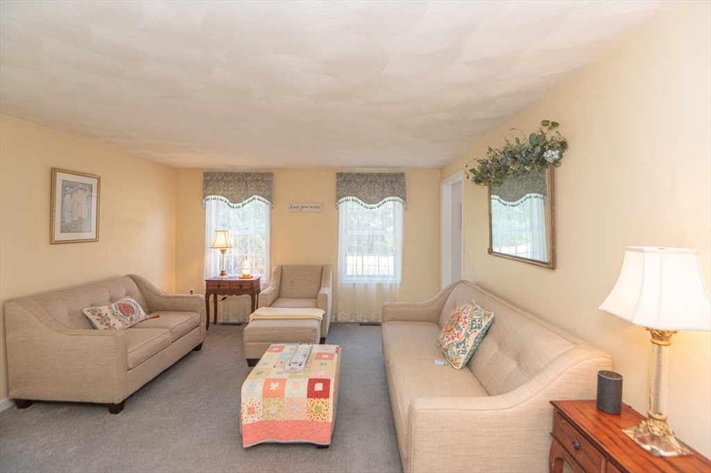 3 Maria Drive Ipswich, MA 01938 - Photo 13 of 36 a living room with furniture and a lamp