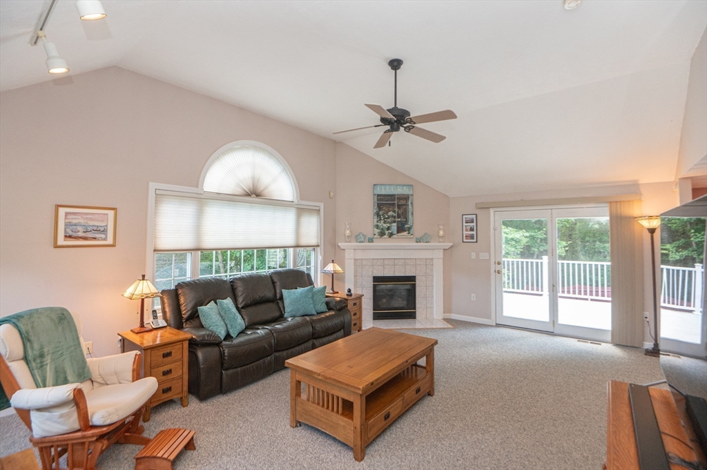 3 Maria Drive Ipswich, MA 01938 - Photo 17 of 36 a living room with furniture and a fireplace
