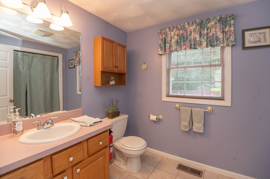 3 Maria Drive Ipswich, MA 01938 - Photo 18 of 36 a bathroom with a double vanity sink toilet and a mirror