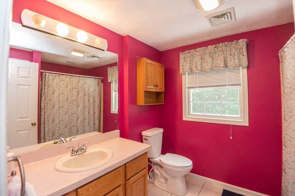 3 Maria Drive Ipswich, MA 01938 - Photo 28 of 36 a bathroom with a sink a toilet and mirror