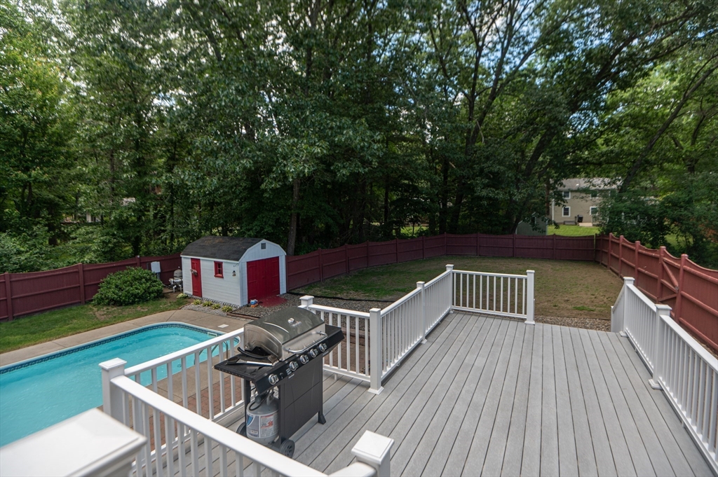 3 Maria Drive Ipswich, MA 01938 - Photo 33 of 36 a view of a chairs and table on the wooden deck