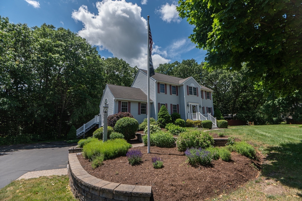 3 Maria Drive Ipswich, MA 01938 - Photo 5 of 36 a front view of a house with a yard