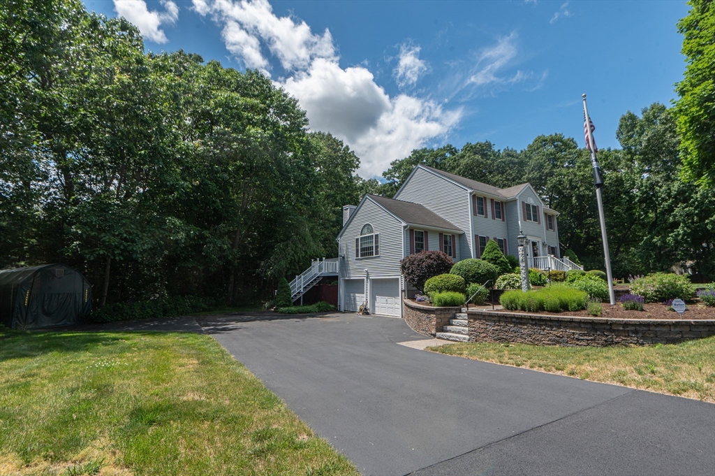 3 Maria Drive Ipswich, MA 01938 - Photo 6 of 36 a front view of a house with garden