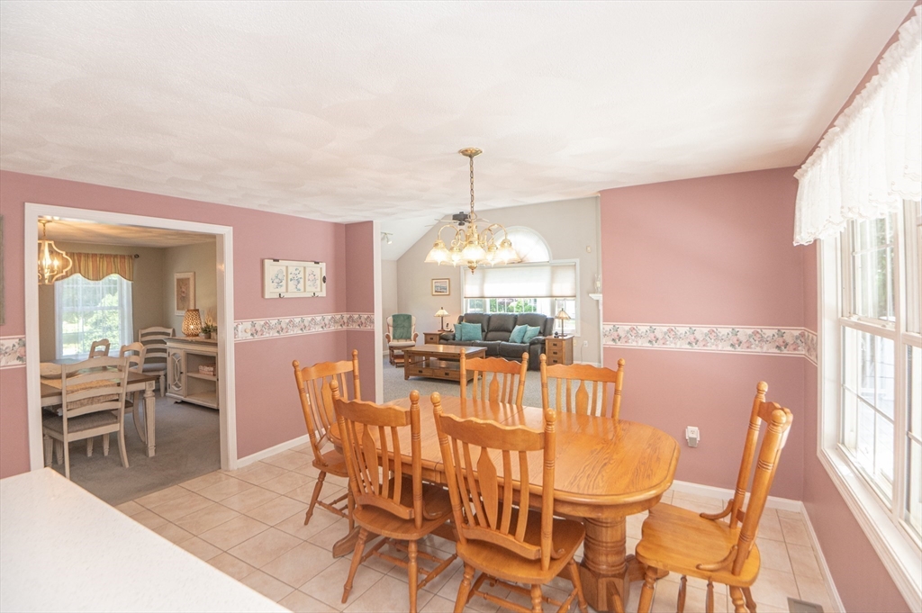 3 Maria Drive Ipswich, MA 01938 - Photo 10 of 36 a dining room with furniture a chandelier and wooden floor