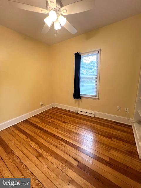 551 Washington Avenue Ewing, NJ 08628 - Photo 12 of 35 en empty room with wooden floor and fan