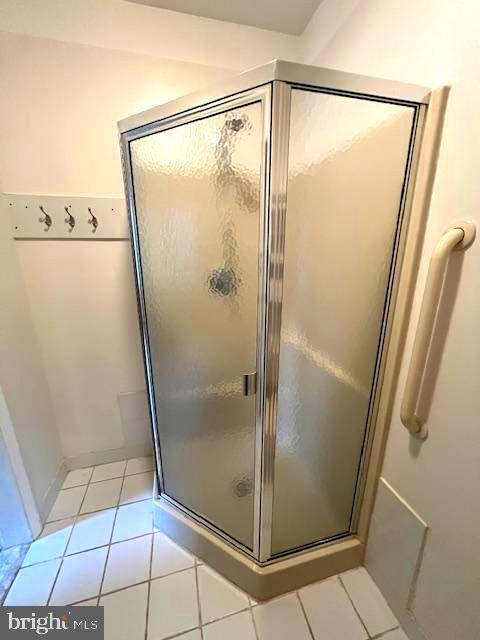 551 Washington Avenue Ewing, NJ 08628 - Photo 15 of 35 a bathroom with a glass shower door