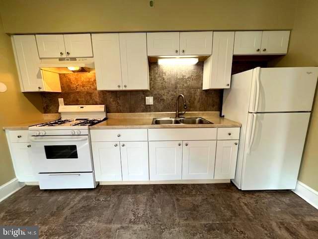 551 Washington Avenue Ewing, NJ 08628 - Photo 18 of 35 a kitchen with a white stove refrigerator and white cabinets with wooden floor