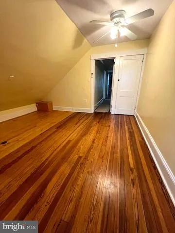 a view of a house with more windows and brick walls