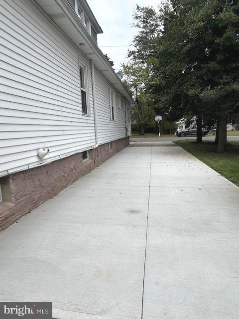 551 Washington Avenue Ewing, NJ 08628 - Photo 29 of 35 a view of a yard with car parked on road