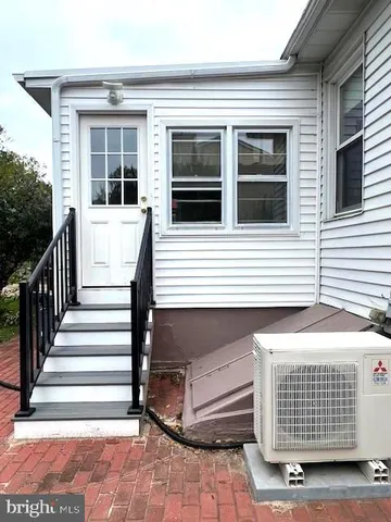 a view of house with backyard