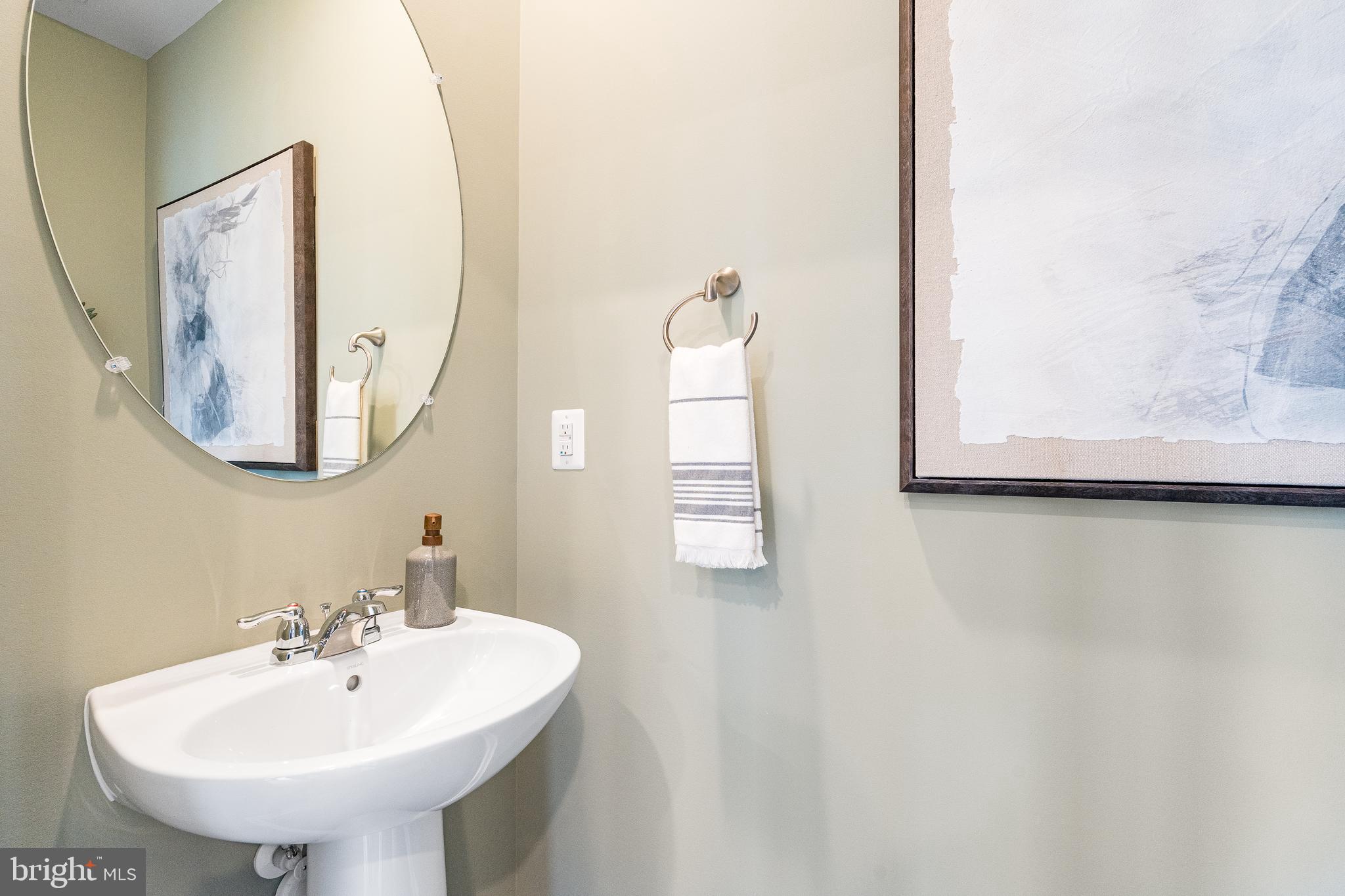 1326 Red Clover Lane Ranson, WV 25438 - Photo 17 of 21 a bathroom with a sink and a mirror