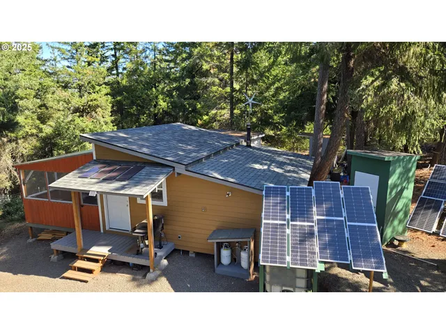 a balcony with table and chairs