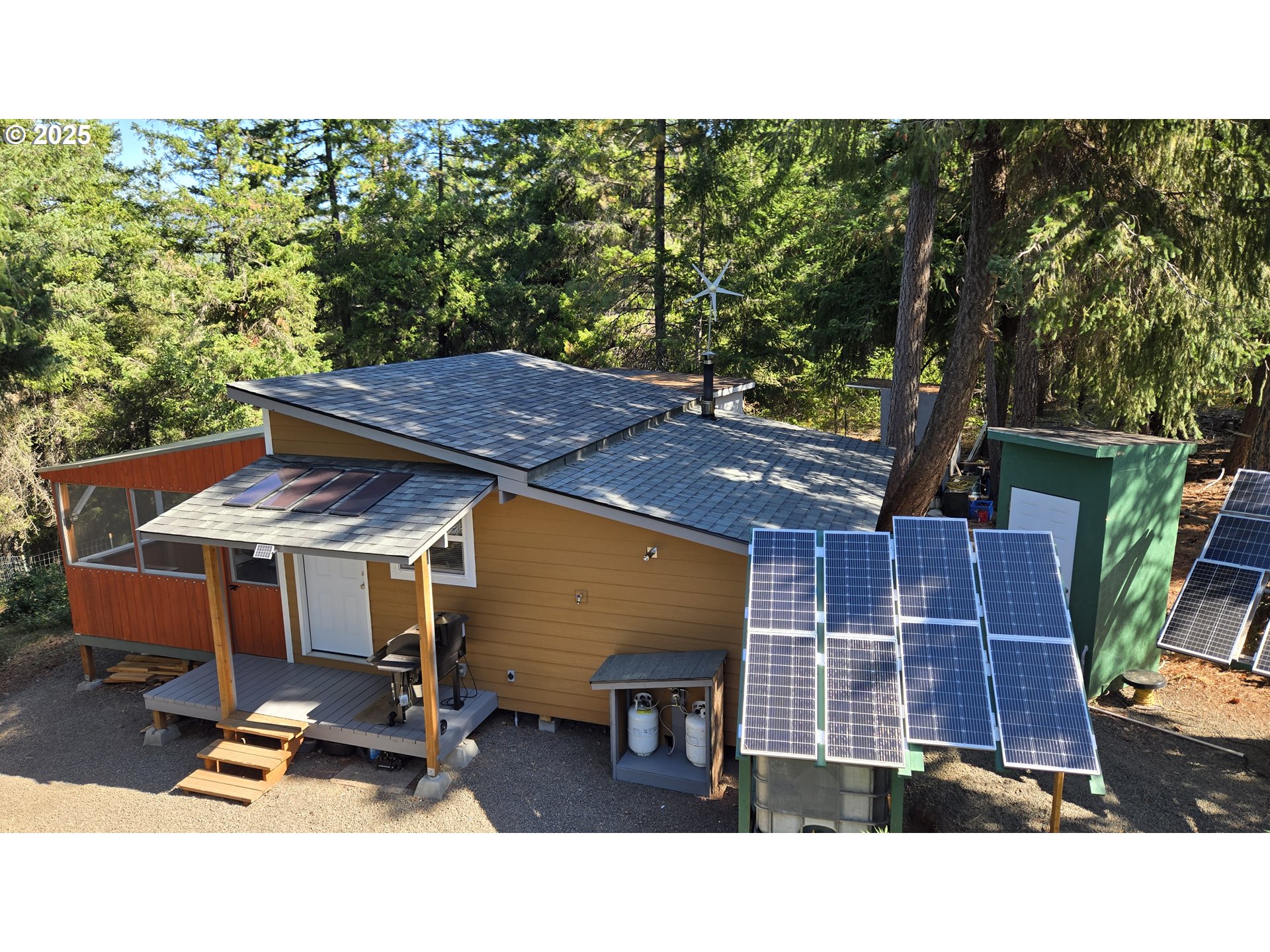 a balcony with table and chairs