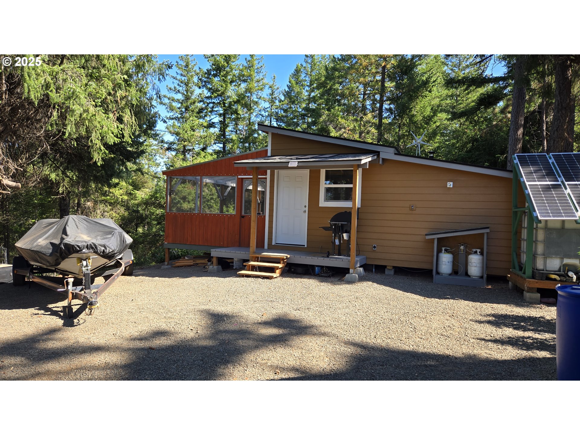 Pine Ridge, Unit 54 Goldendale, WA 98620 - Photo 15 of 43 a backyard of a house with table and chairs