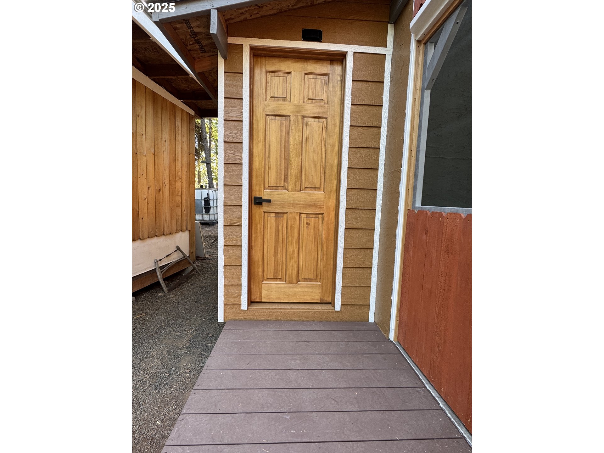 Pine Ridge, Unit 54 Goldendale, WA 98620 - Photo 16 of 43 a view of a house with a door and wooden floor