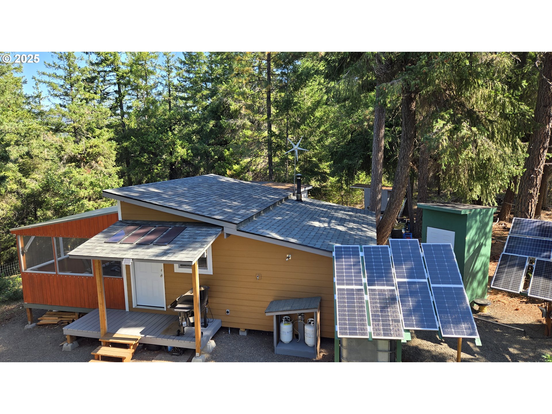 Pine Ridge, Unit 54 Goldendale, WA 98620 - Photo 20 of 43 a backyard of a house with table and chairs