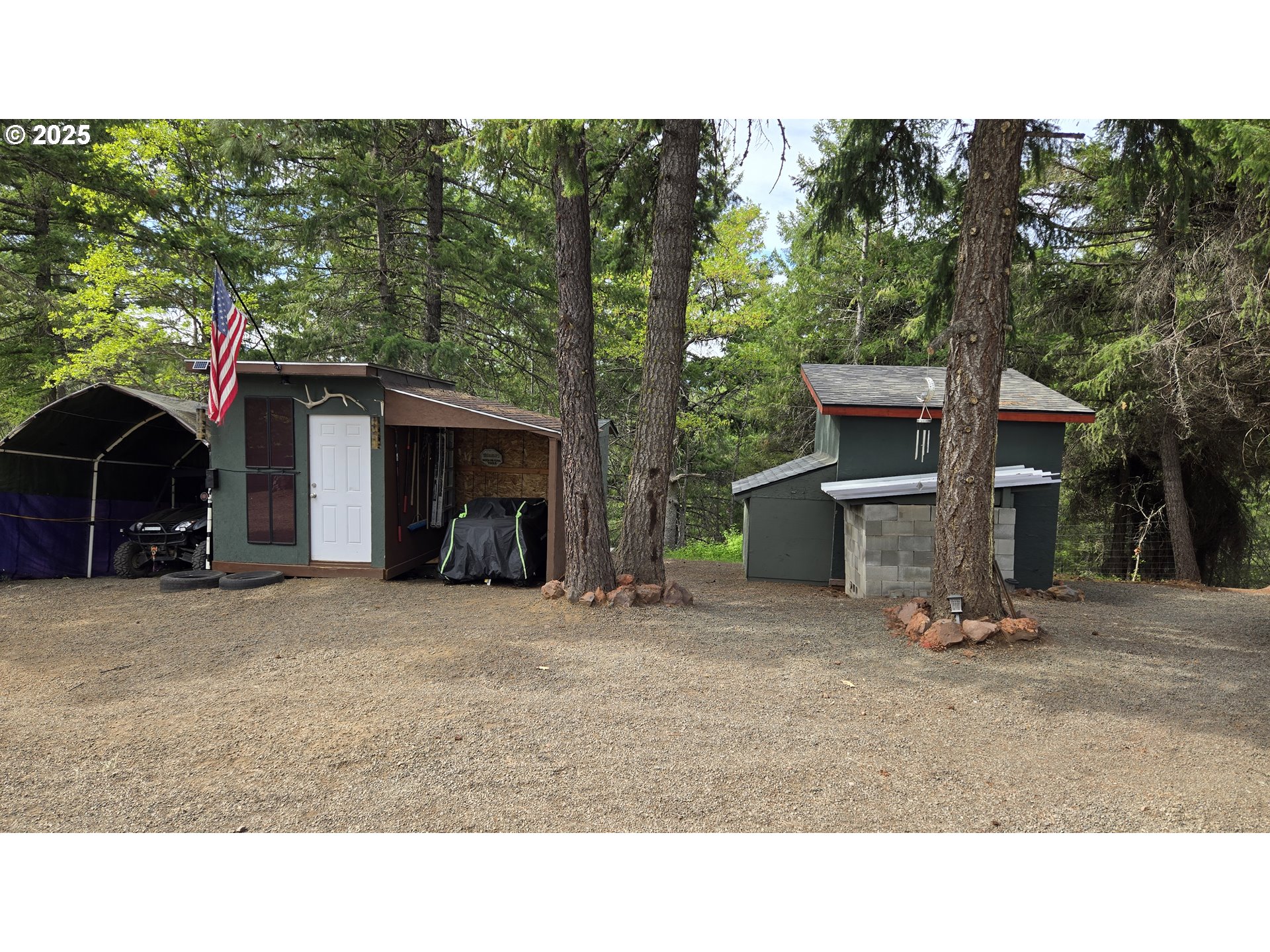 Pine Ridge, Unit 54 Goldendale, WA 98620 - Photo 22 of 43 a black and white house with a yard