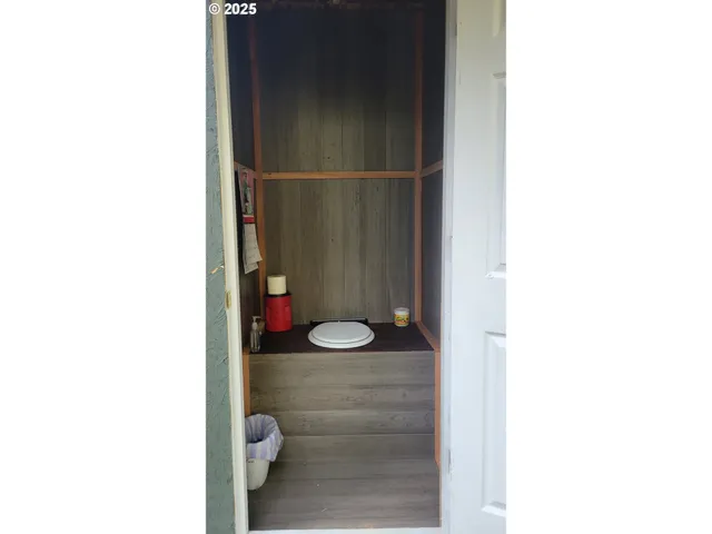 a view of a lush green hillside and a building