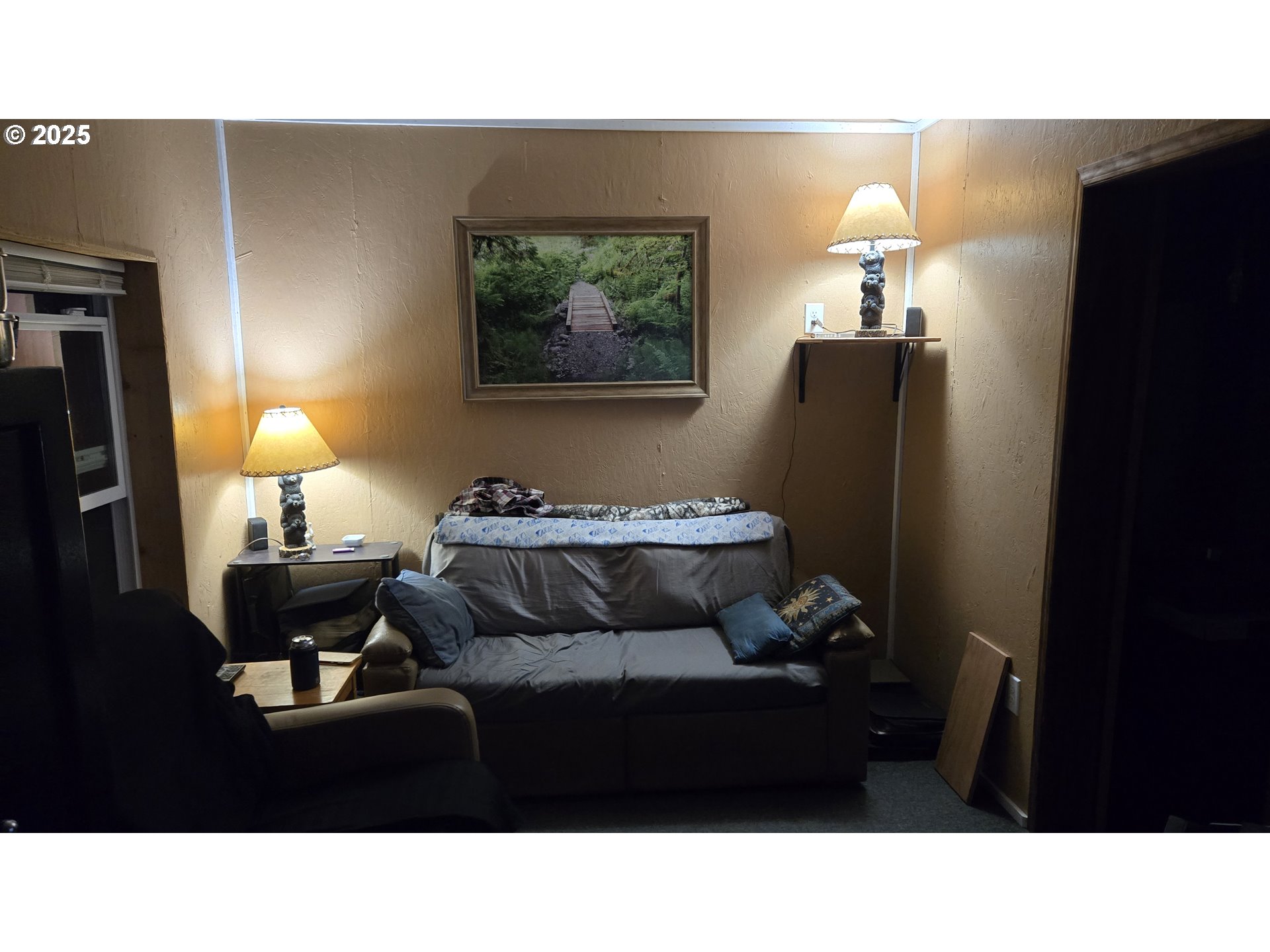 Pine Ridge, Unit 54 Goldendale, WA 98620 - Photo 9 of 43 a living room with furniture and a lamp