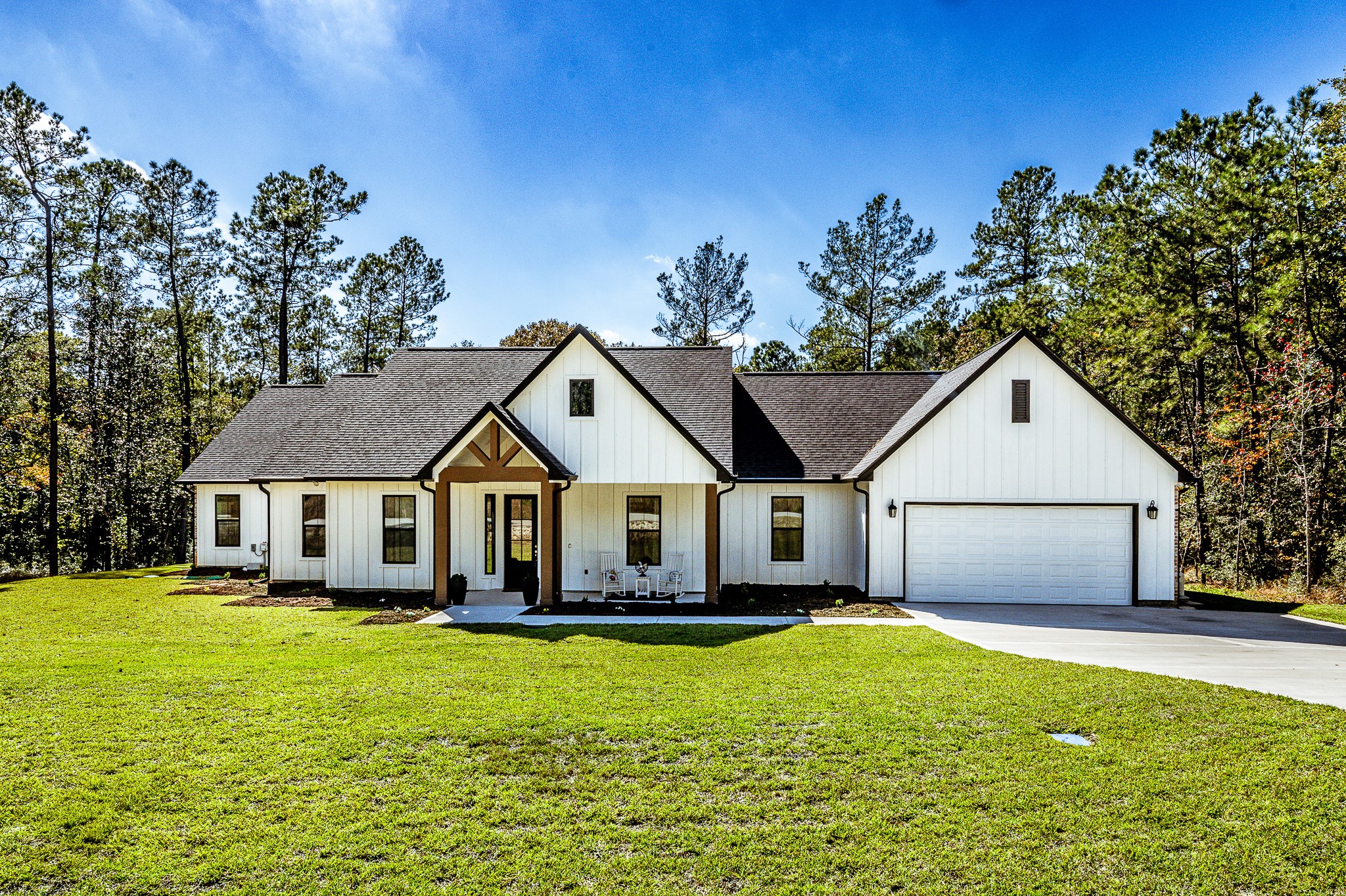 111 Eagle Run Road Willis, TX 77378 - Photo 2 of 44 Charming modern farmhouse with sleek design, nestled in a tranquil setting. Bright interiors, spacious layout, and a welcoming porch create the perfect blend of style and comfort.