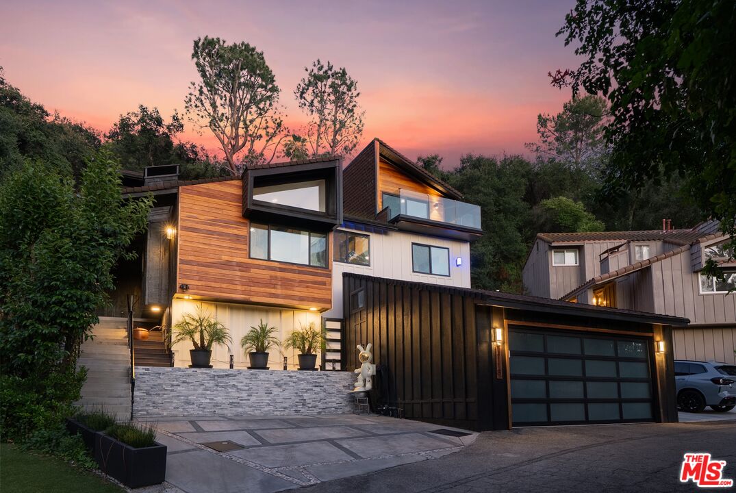 4118 Oak Hollow Road Calabasas, CA 91302 - Photo 2 of 55 a front view of a house with a yard