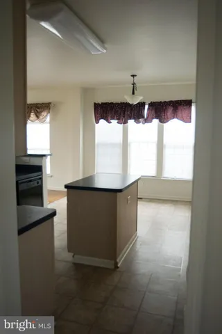 a living room with granite countertop furniture and a fireplace