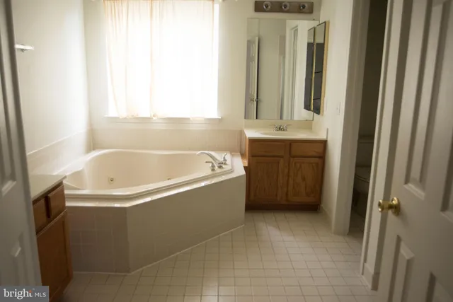 a bathroom with bathtub and a sink